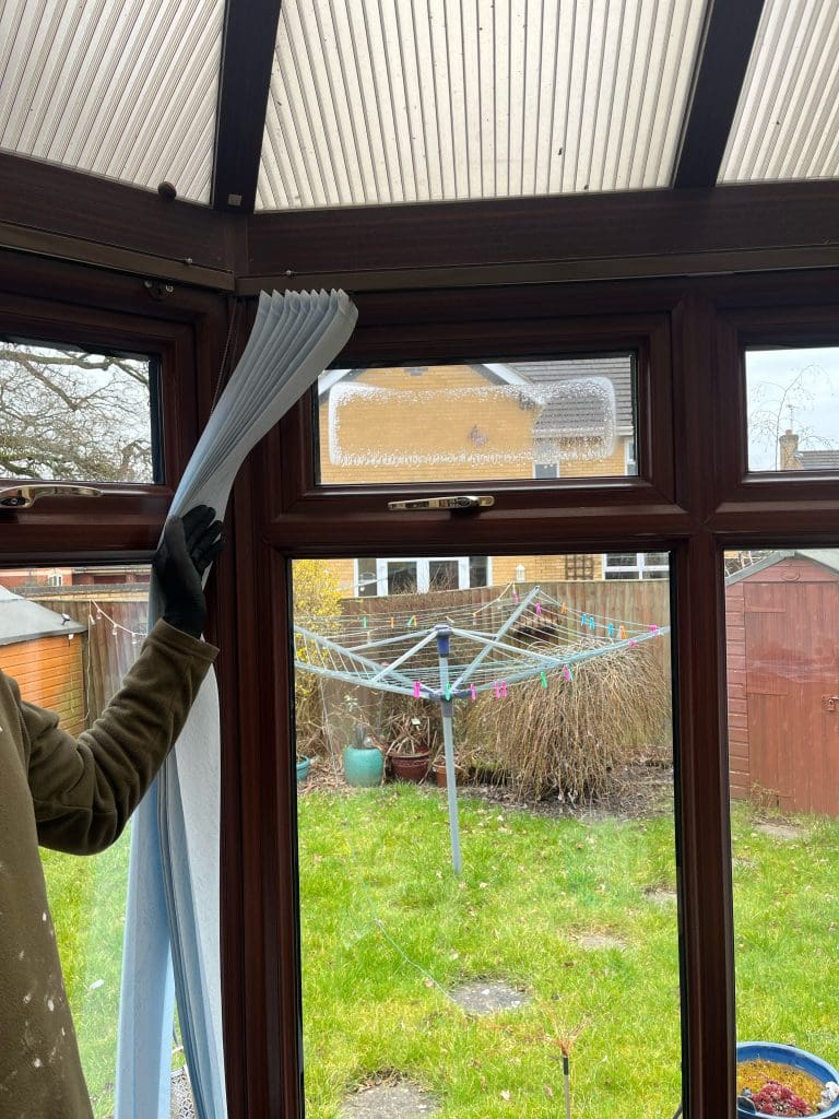 Conservatory window showing internal mist and condensation before repair